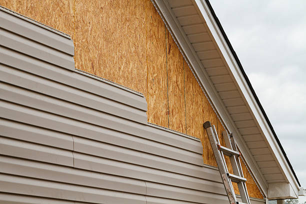 Professional Storm Damage Siding Repair technician working in Bushwood, MD